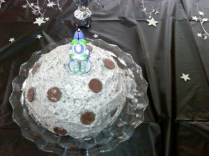 Sweet Earth Fair Trade Milk Chocolate drop craters. Cake baked in a bowl. Buzz Light Year candle topper. 